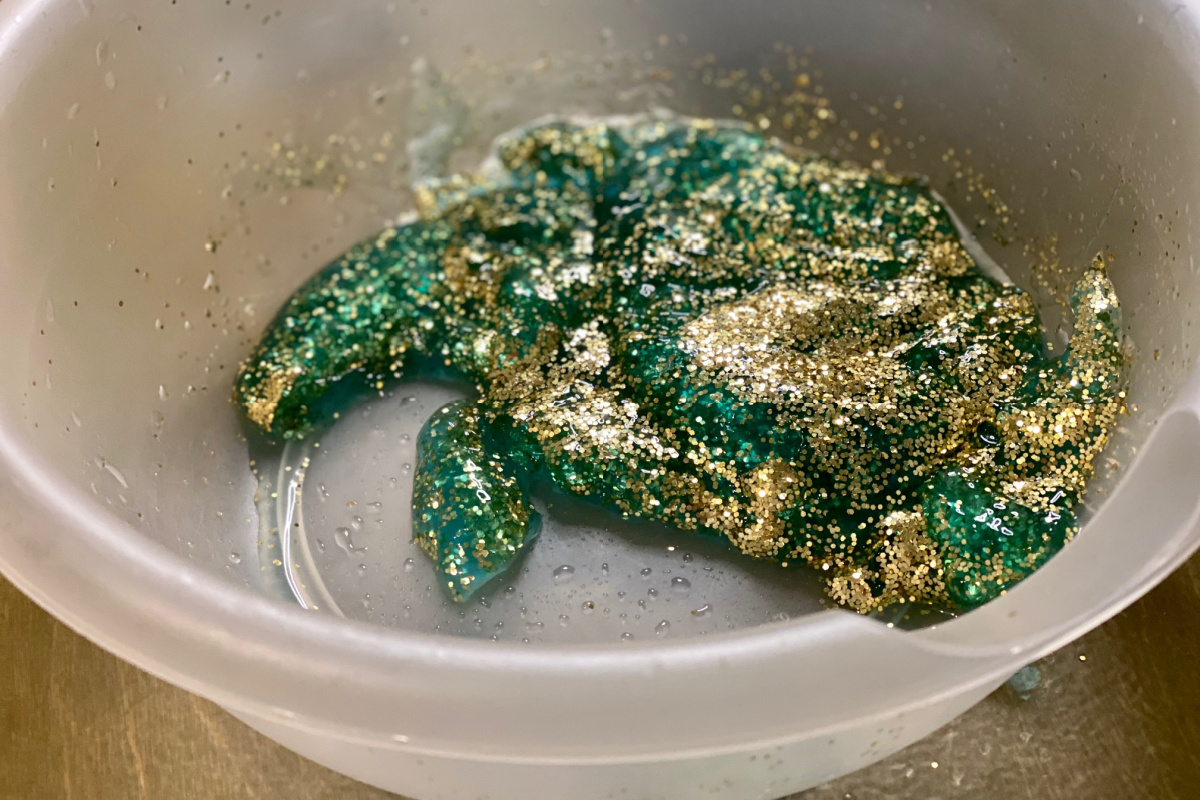 Green and gold slime in bowl