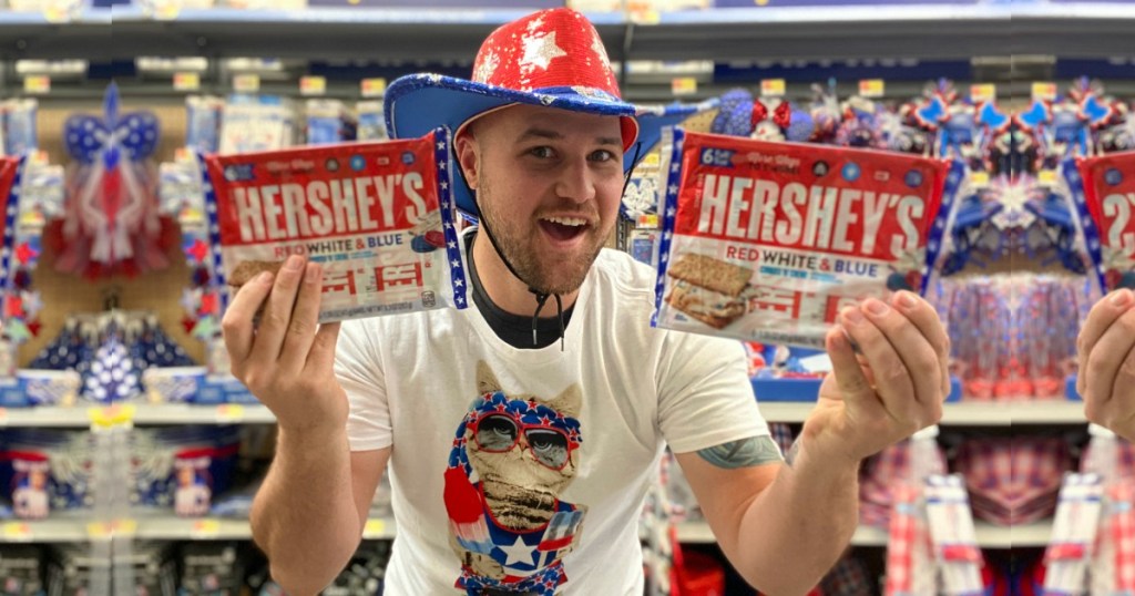 Man holding red white and blue hershey's bars in patriotic attire