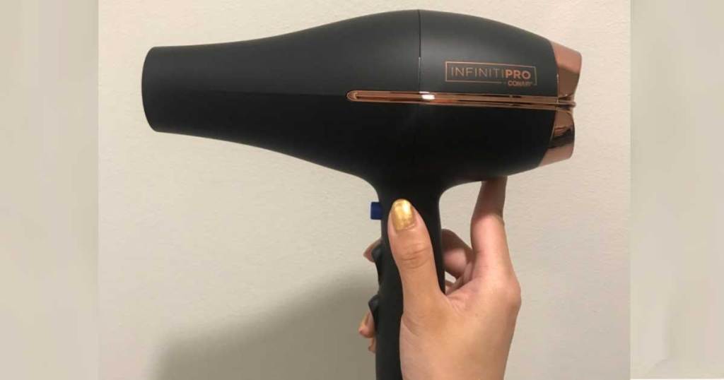 hand holding a conair hair dryer