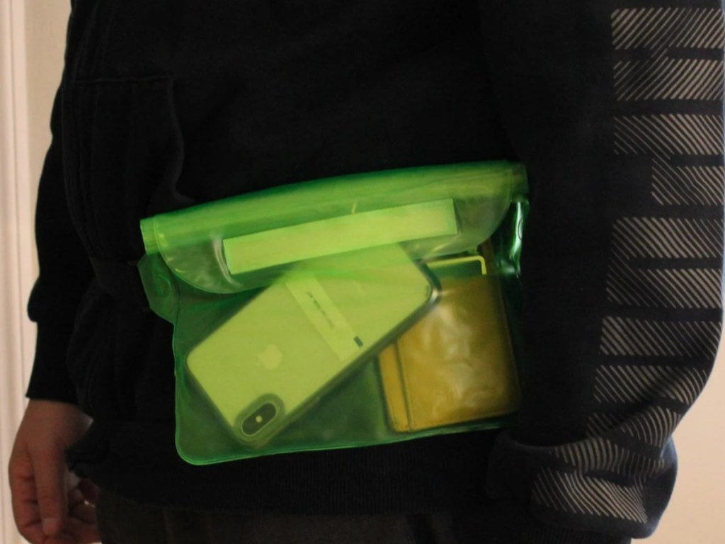 person wearing clear green fanny pack