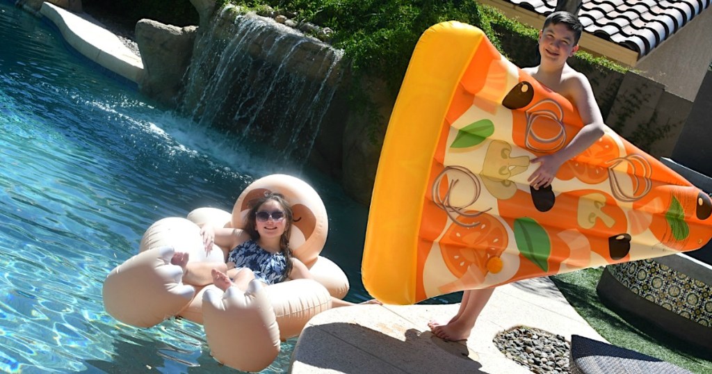 girl in pool on float, boy holding pizza float