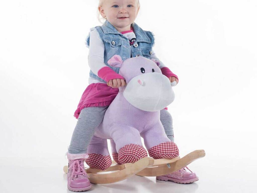 hippo riding rocker toy with little girl sitting on it