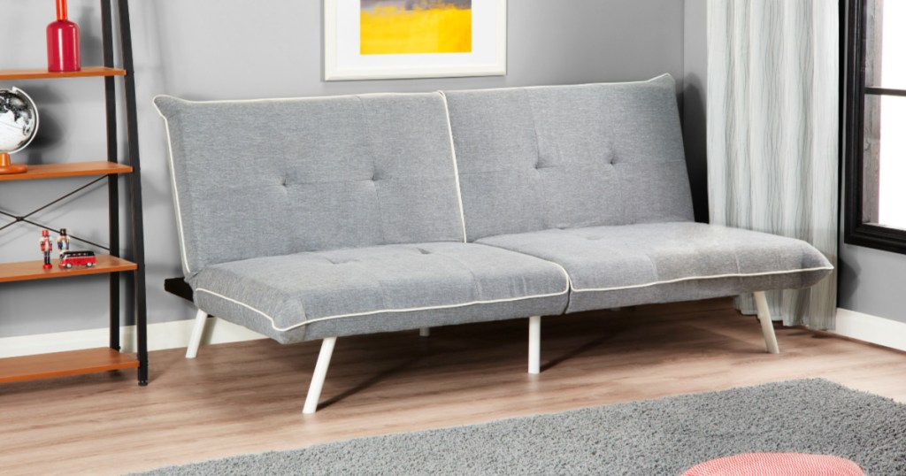 living room with a Mainstays Oversize Full-XL Futon with Contrast Piping