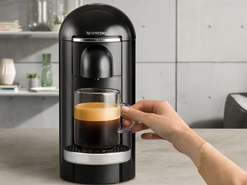 nespresso vertuo plus deluxe coffee maker with hand