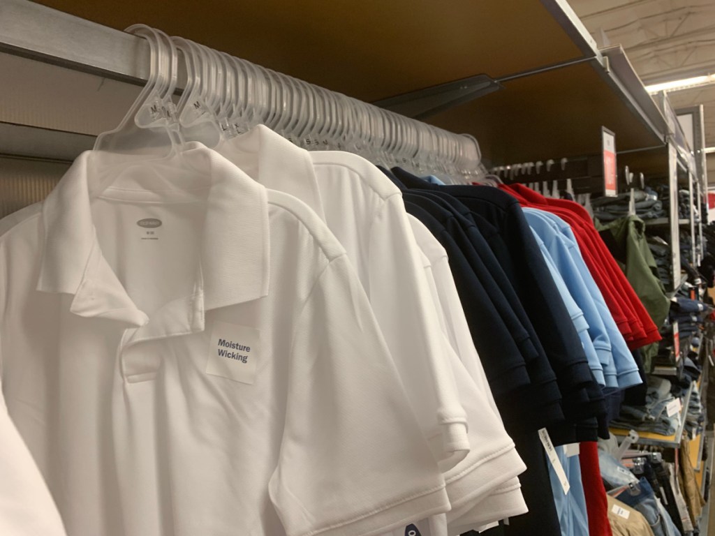 white kid old navy polos hanging in store