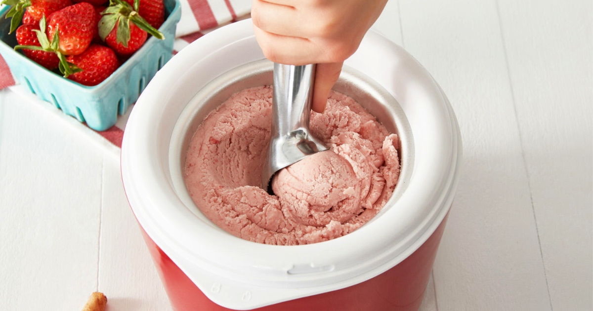 person scooping ice cream out of ice cream maker