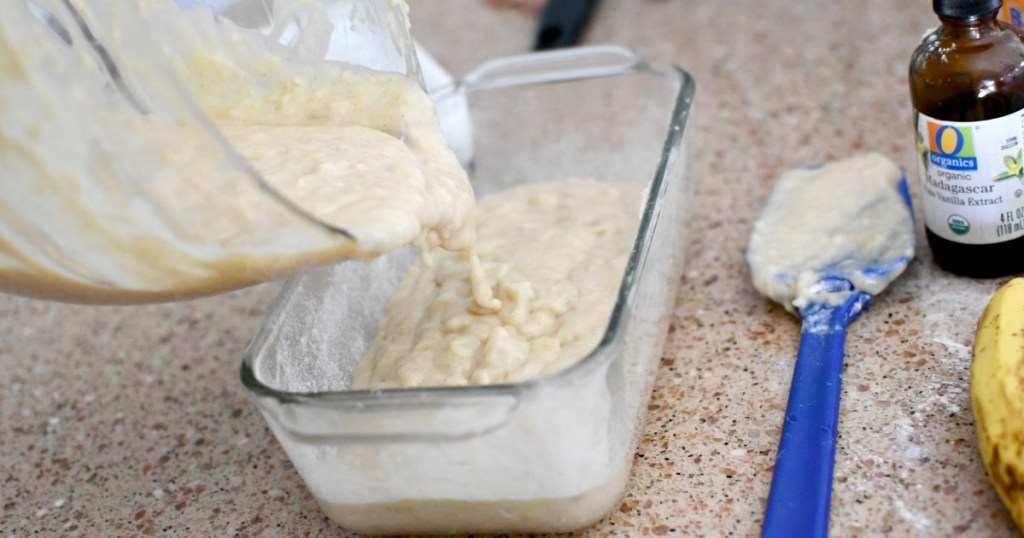 pouring batter into a loaf pan for sour cream