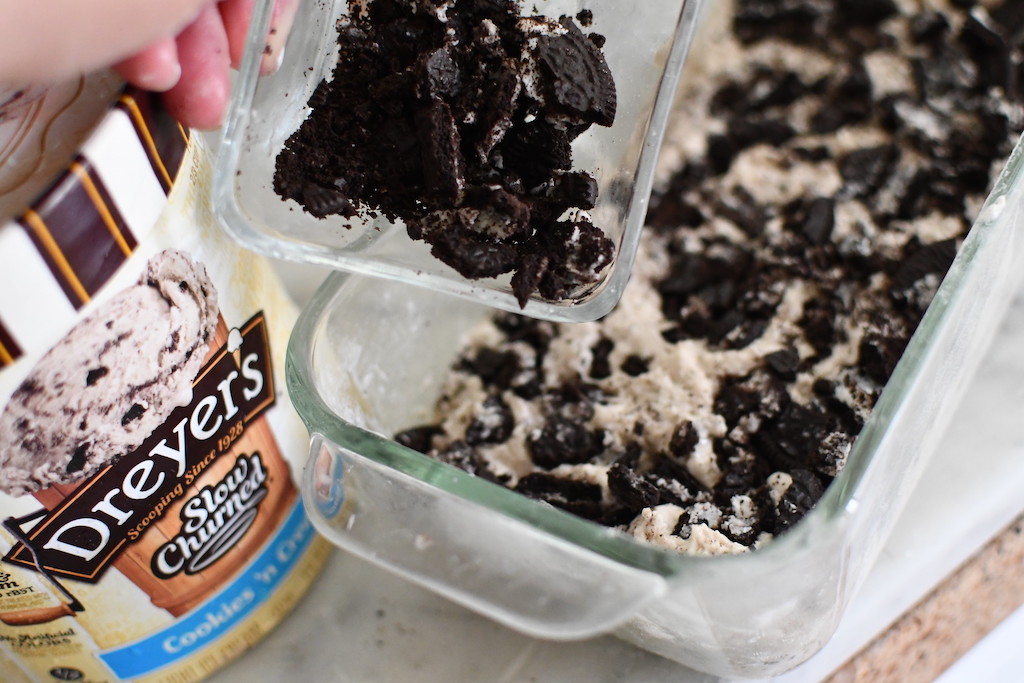 putting oreo cookies in ice cream bread loaf pan 