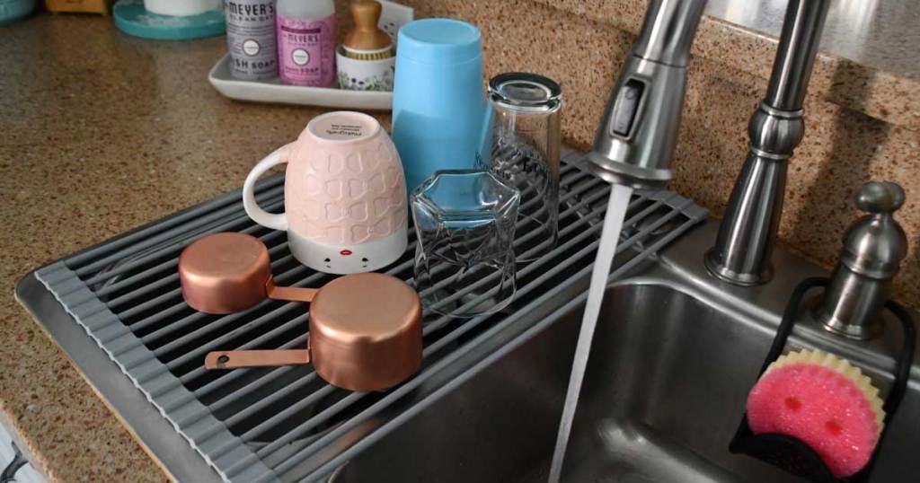 roll up drying rack on sink in kitchen