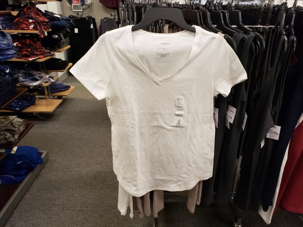 white vneck womens tee hanging in store
