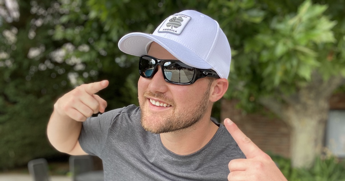man wearing Oakley Men's Valve Sunglasses with white hat on outside