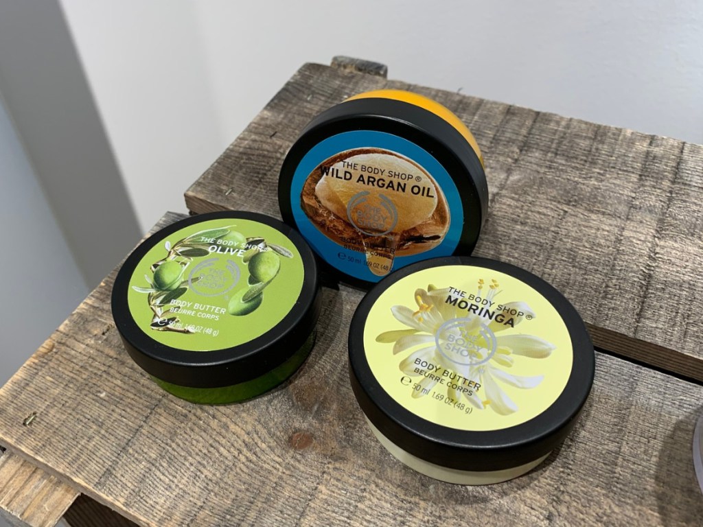 the body shop body butters on wood surface