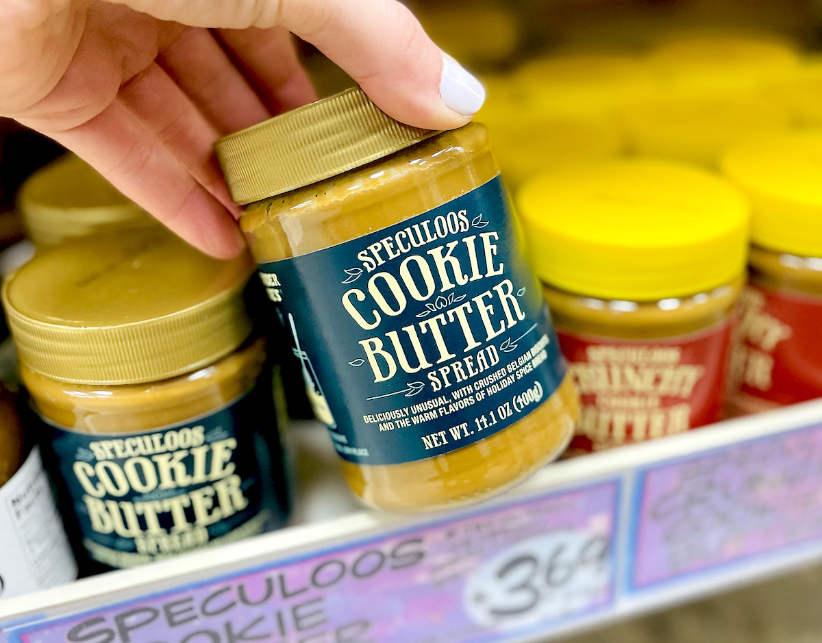 hand pulling cookie butter off shelf