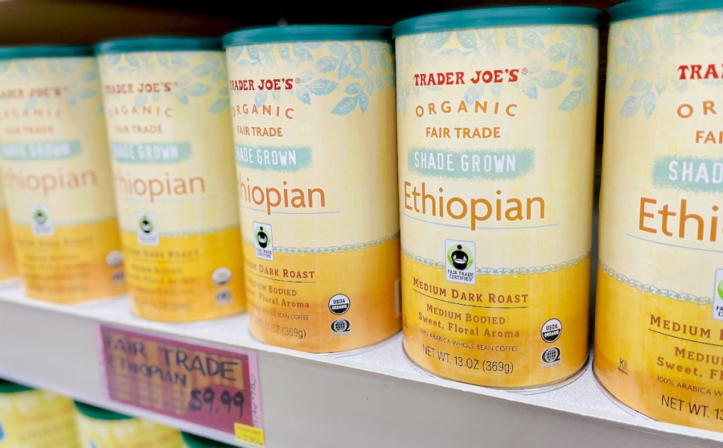 row of can of ethiopian whole bean coffee on shelf