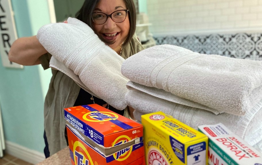 woman holding white towels