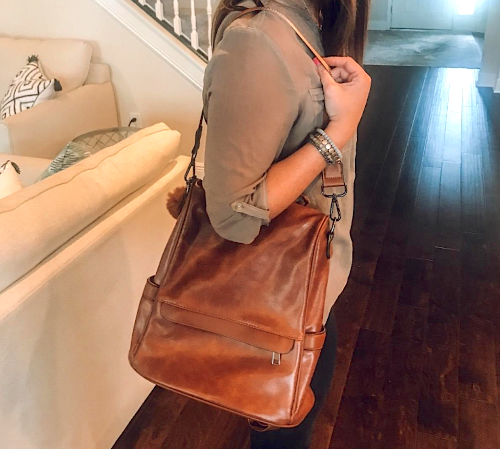 woman wearing brown leather purse 