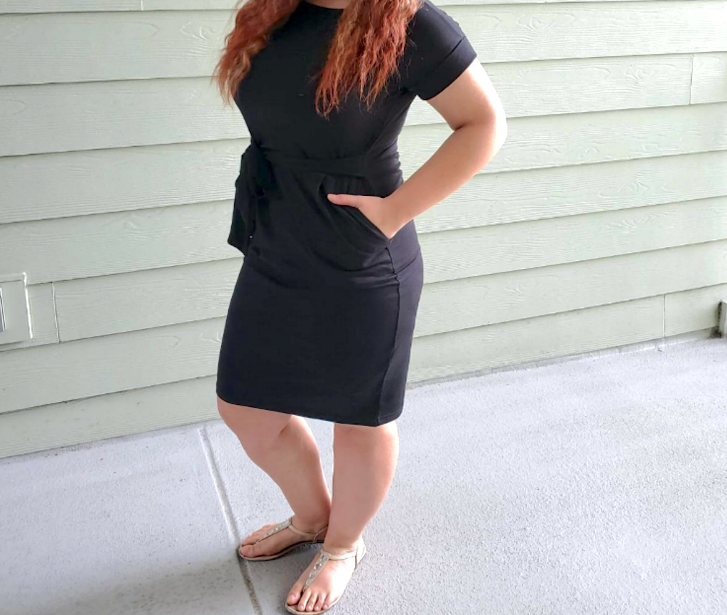 woman wearing pencil dress with gold sandals 