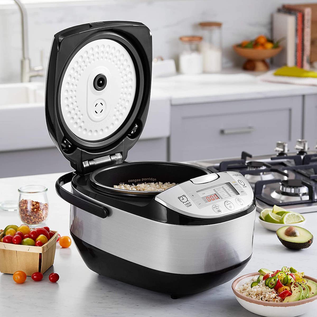 lid open on AmazonBasics Multi-Functional Rice Cooker on counter with rice inside of it