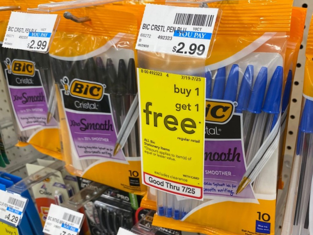 packs of blue pens and packs of black pens hanging in store