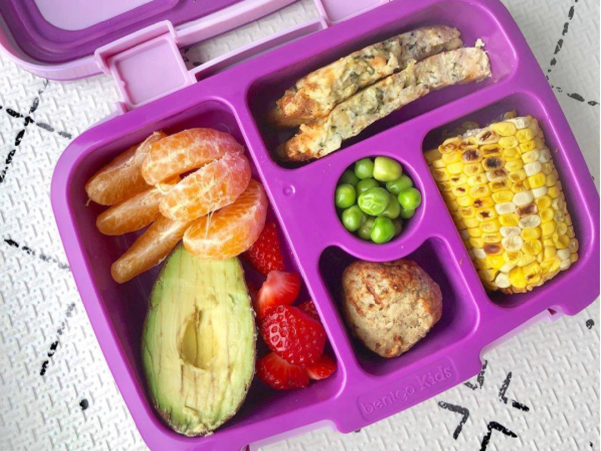 kids purple lunch box filled with food