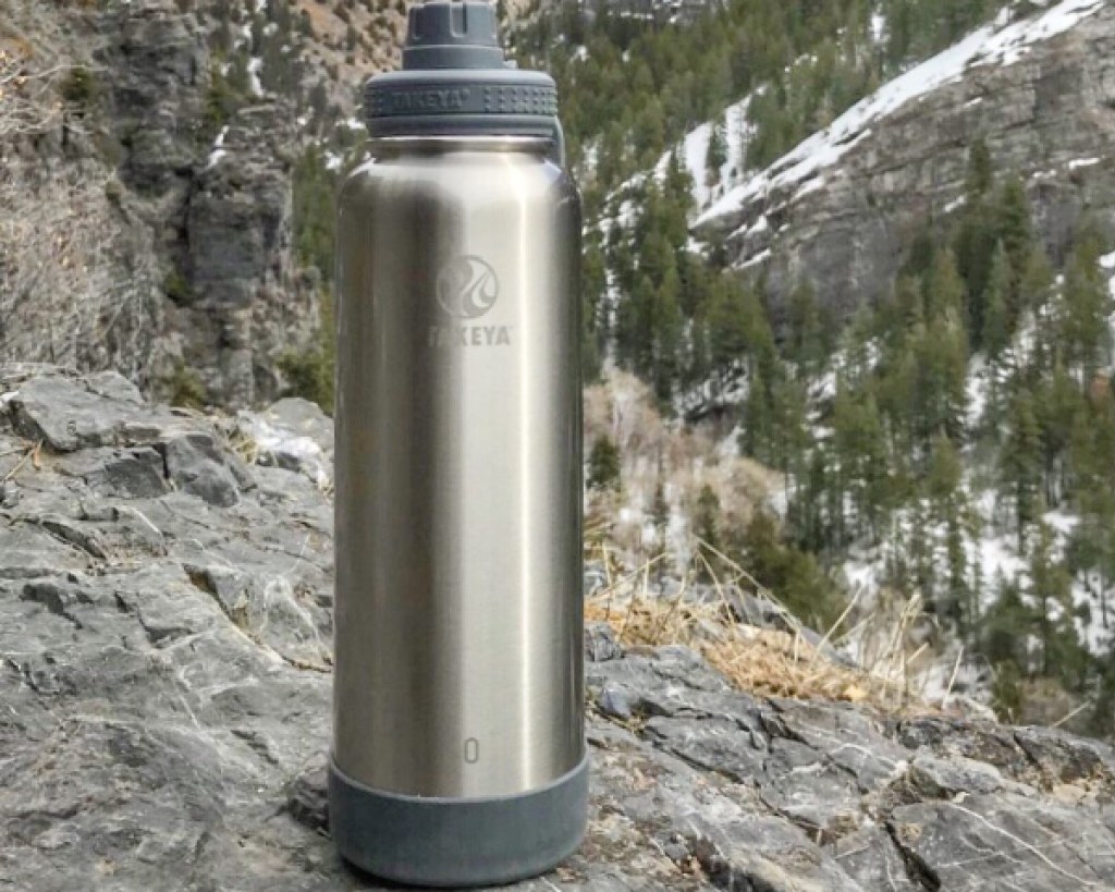 takey stainless steel water bottle in mountains