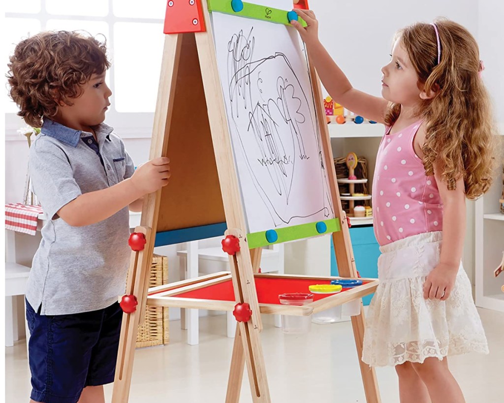 hape all in one wooden easel two kids on each side
