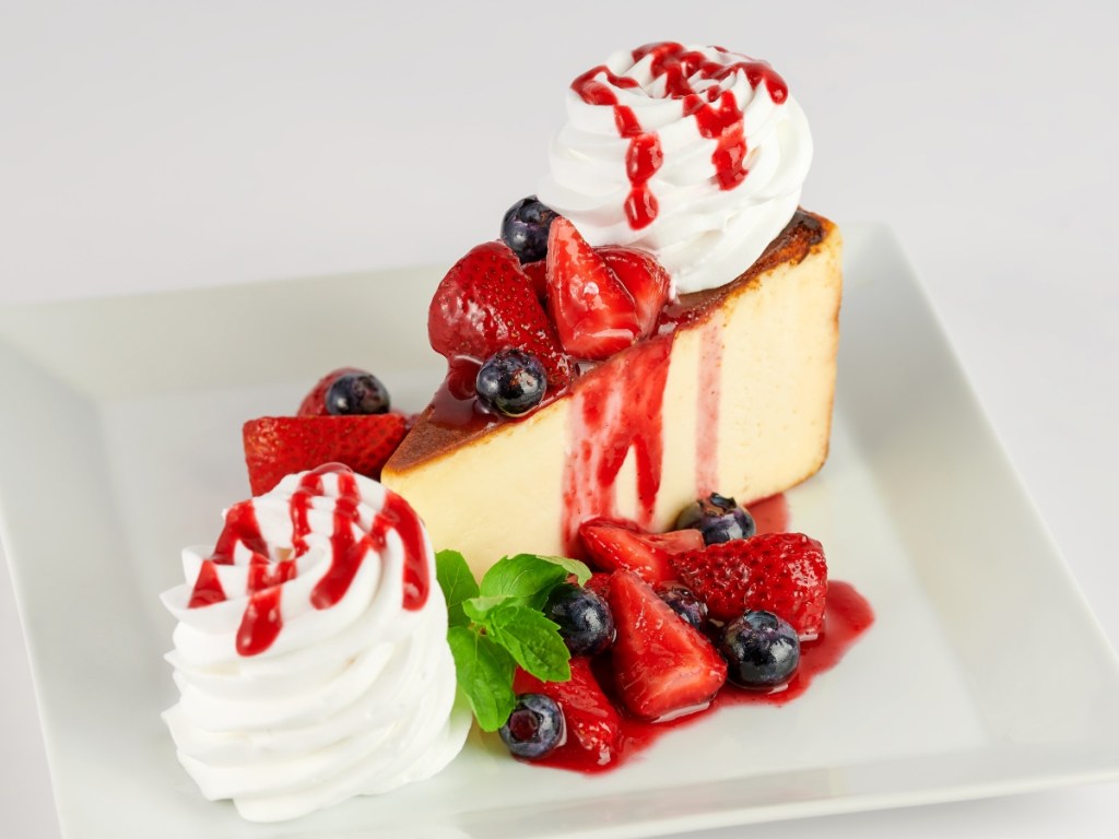 Slice of cheesecake topped with fruit