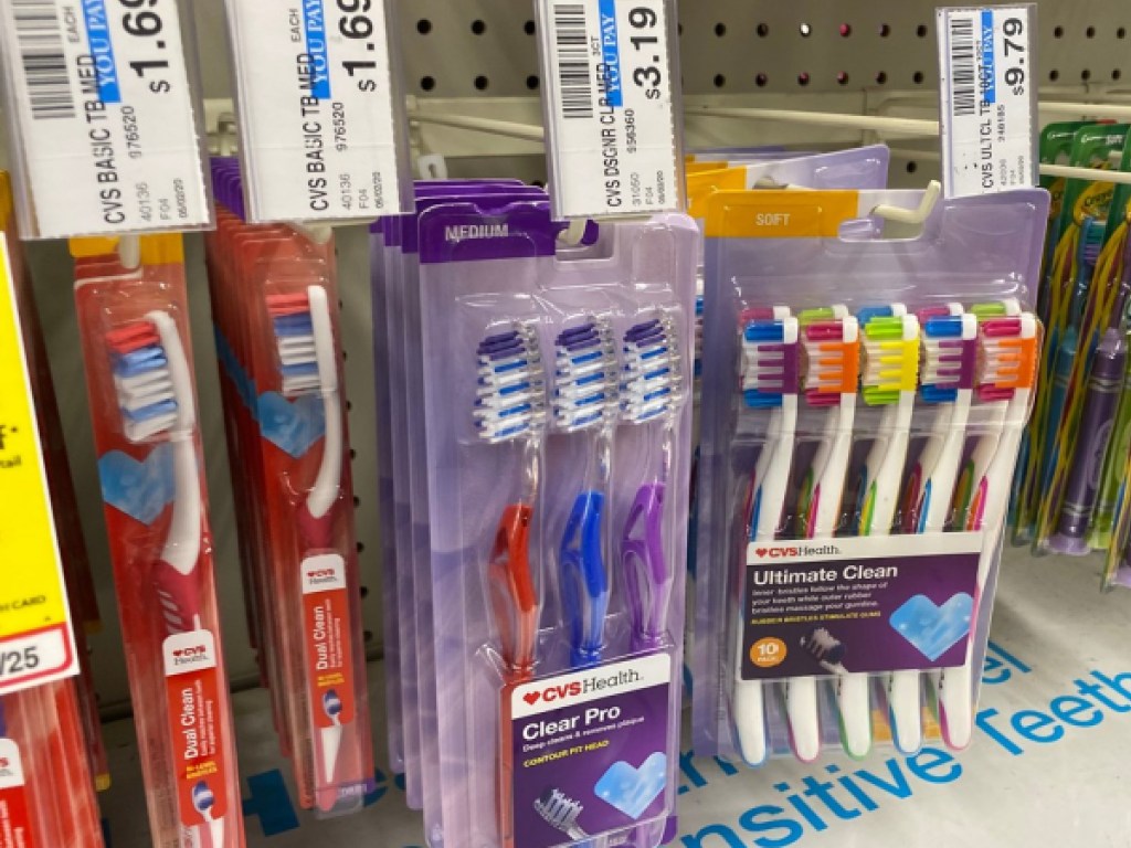 CVS Health 3-Pack toothbrushes on shelf in store
