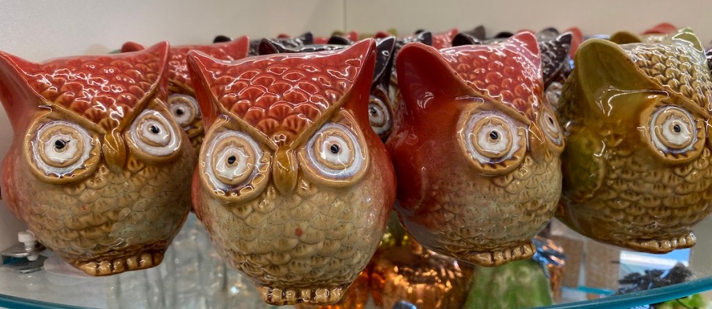 Ceramic Owl Statues on shelf