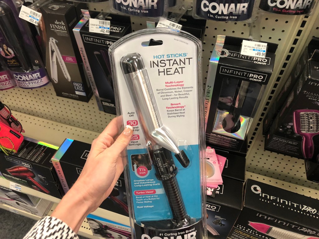 hand holding a Conair Curling iron
