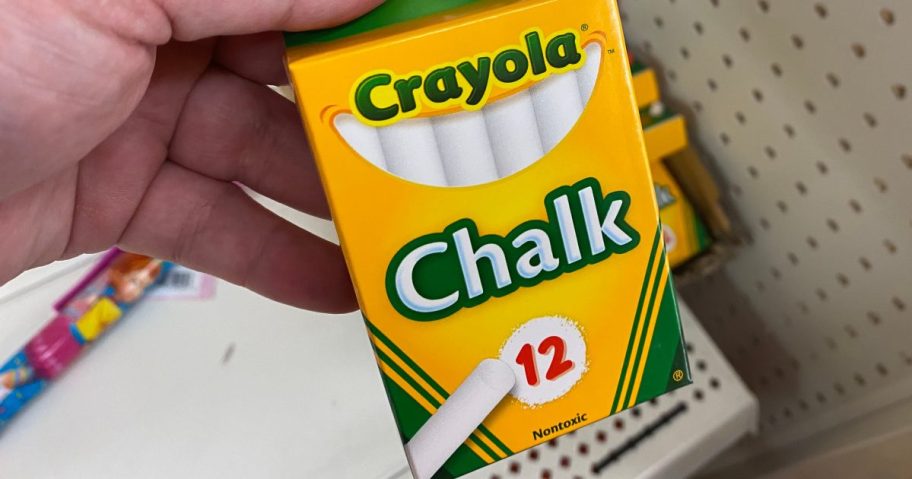 hand holding box of white chalk in store