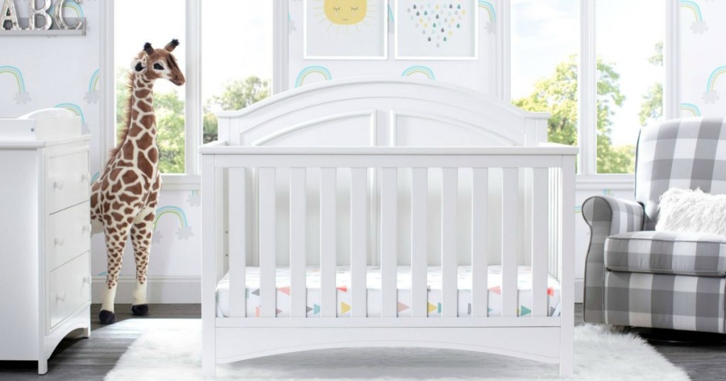 nursery with white crib and dresser