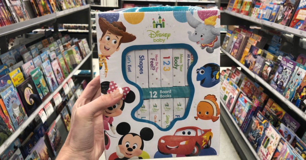 hand holding Disney Baby Board Book Set in-store