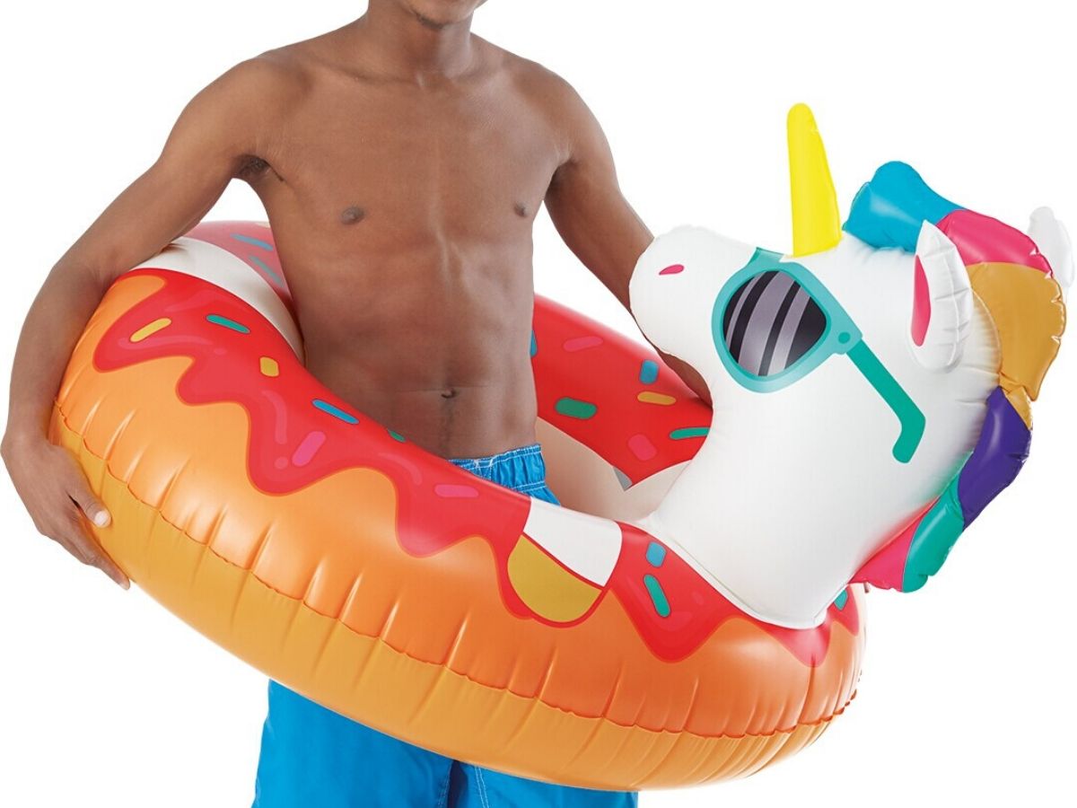 man with a unicorn tube pool float around his waist