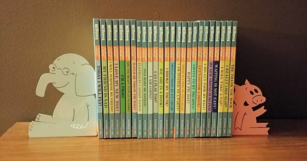 shelf with elephant and piggie books with elephant and pig shaped bookend holders