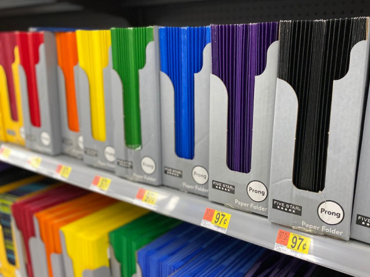 various colored folders on shelf in store