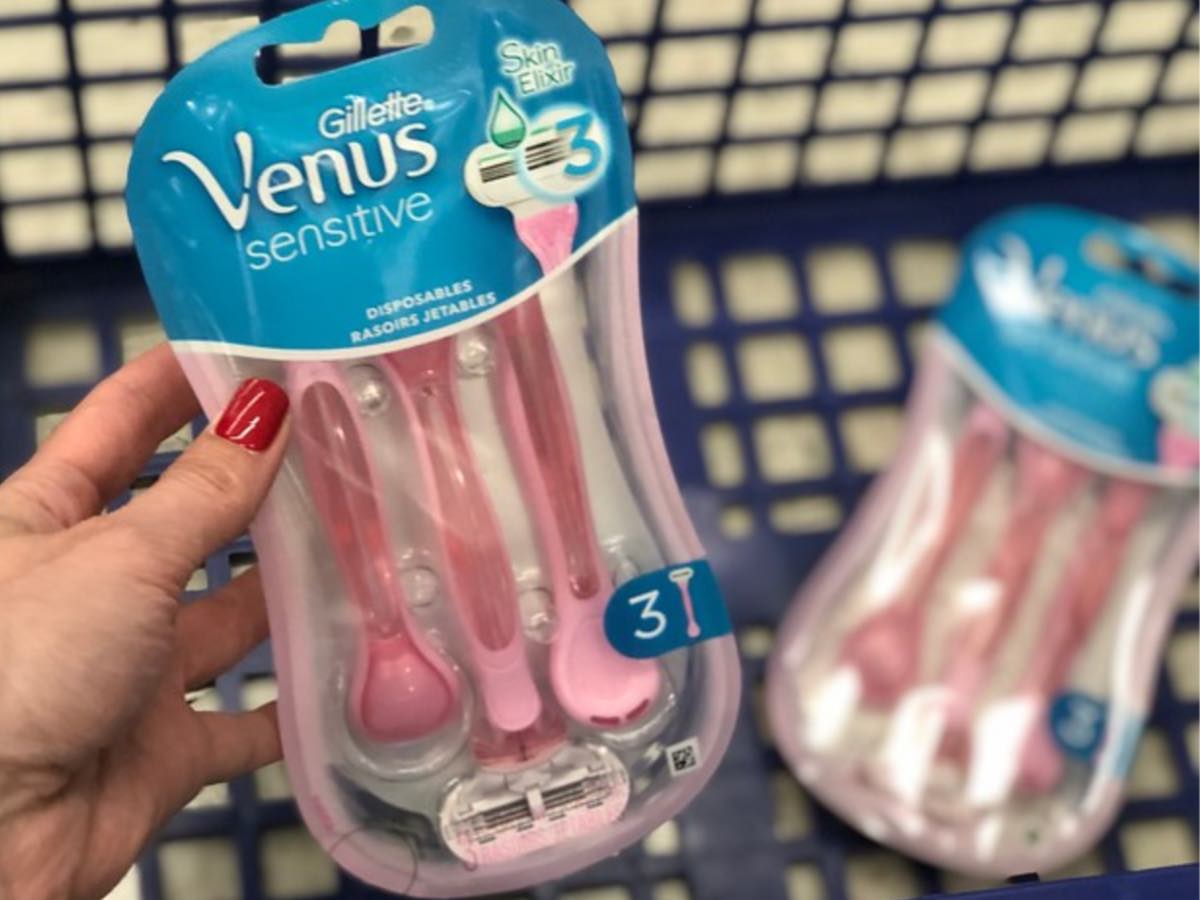 woman hand holding pack of venus sensitive disposable razors