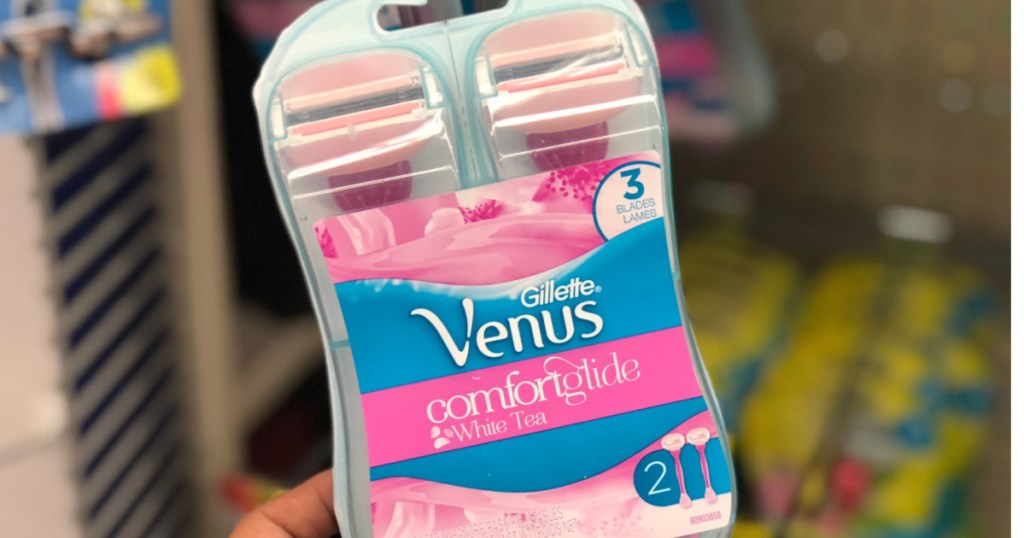 hand holding Gillette Venus white tea razors in-store