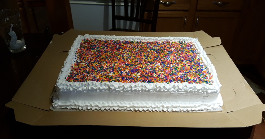 vanilla sheet cake with sprinkles on top