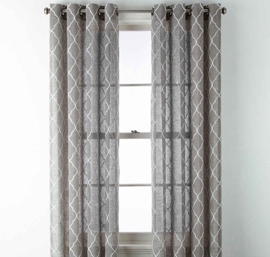 grey curtain panels with white print on white window