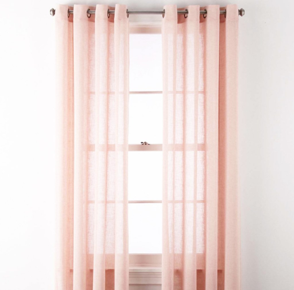pink solid color sheer curtain panels on white window