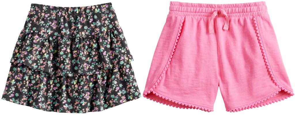 black floral print ruffle skirt and pink shorts with pom poms around hemline