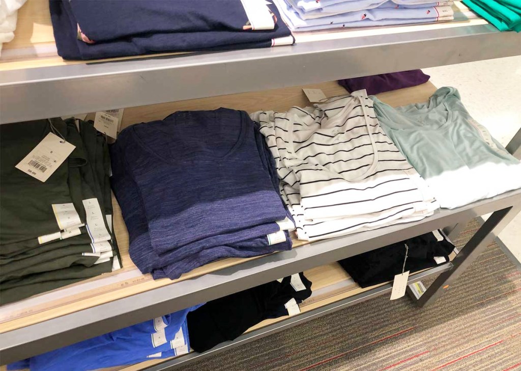 store display shelf of womens basic tees in various colors and prints