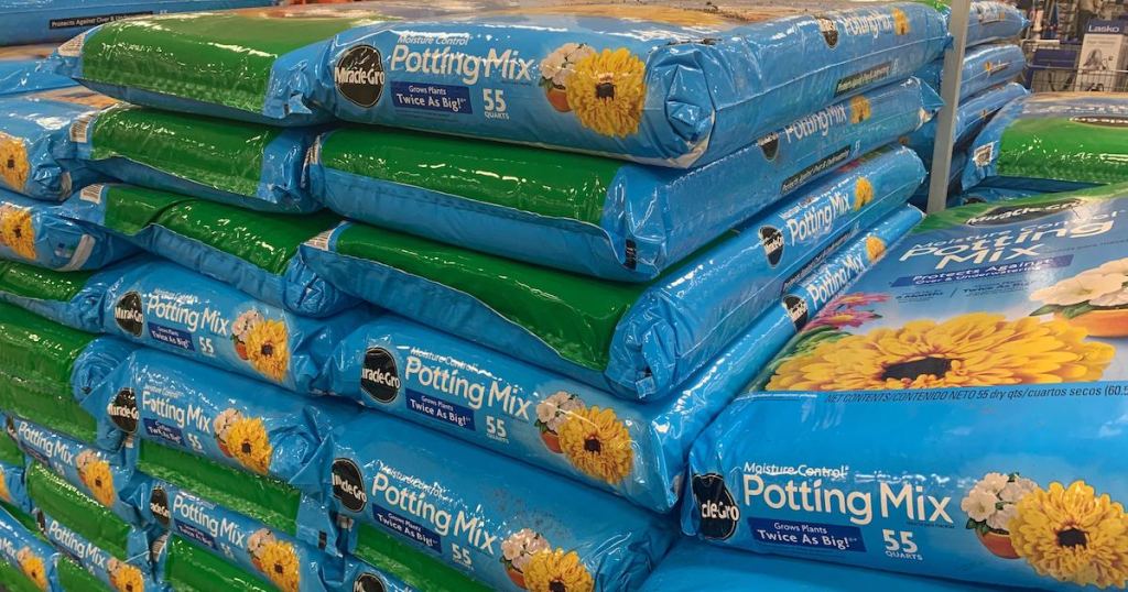 pile of multiple bags of Miracle Gro Potting Mix at Sams Club