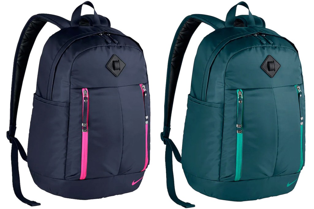 two nike brand backpacks in black with pink zippers and dark green with light green zippers