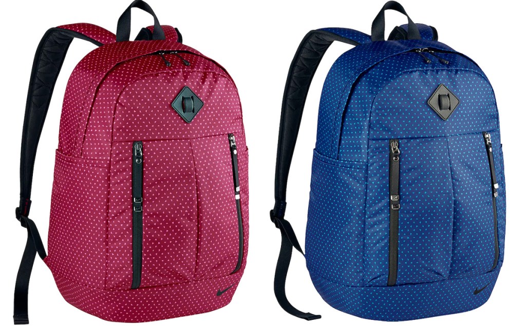 two Nike brand backpacks in maroon and blue colors with mini triangle print allover them