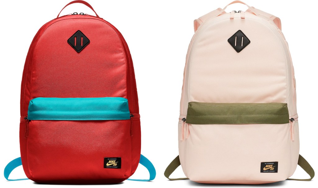two Nike brand backpacks in orange with light blue front pocket and light pink with olive green front pocket