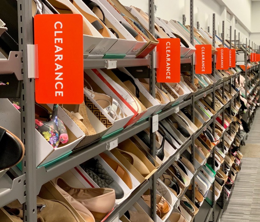 clearance rack full of boxes of women's shoes