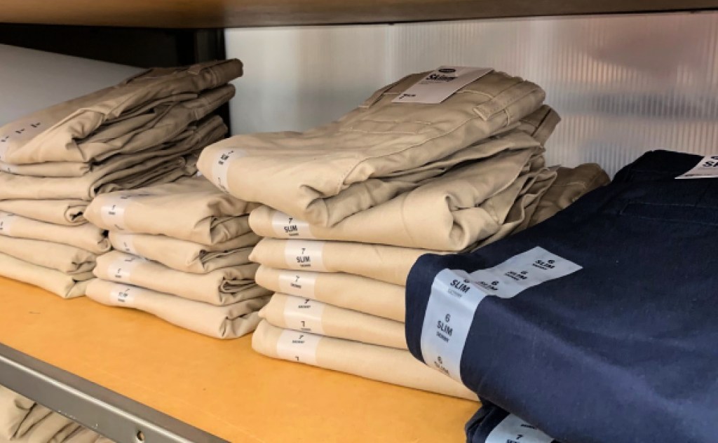 Old navy uniform pants folded on shelf
