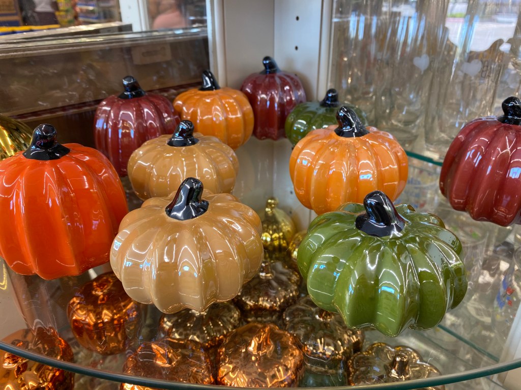 ceramic pumpkins on shelf